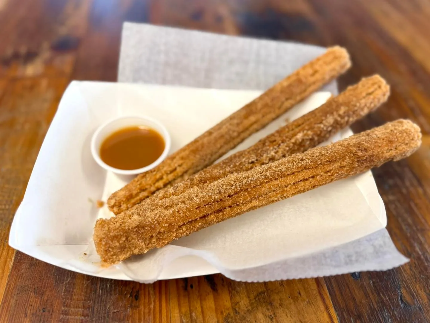 Cinnamon-sugar churros with caramel dipping sauce